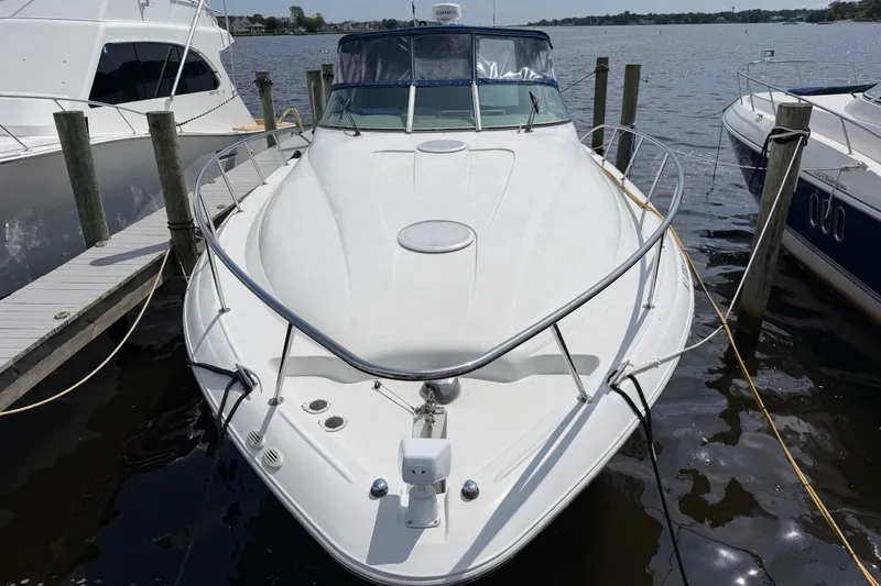 Slide: The Image of 2004 Wellcraft 3700 Martinique yacht docked at marina, front view. - 3