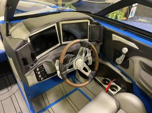 Slide: The Image of The image shows the cockpit of a 2023 Centurion Ri245 with a modern steering wheel and digital displays. - 8