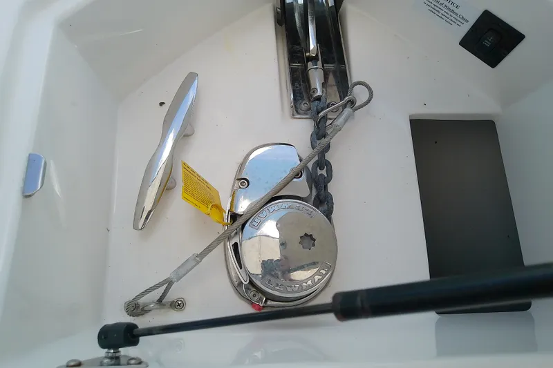Slide: The Image of Anchor compartment of 2019 Regal 29 OBX boat with windlass and chain. - 39