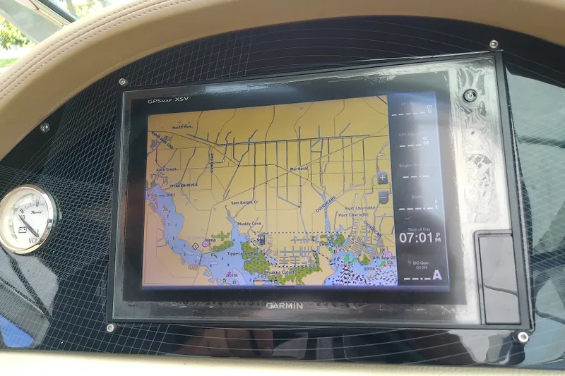 Slide: The Image of Garmin GPS display on 2019 Regal 29 OBX boat, showing navigation map and controls. - 26
