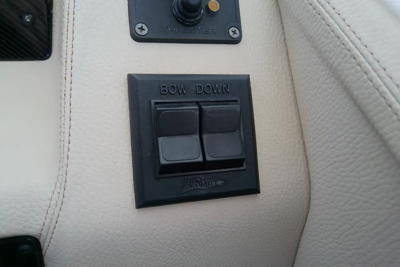 Slide: The Image of Control panel on 2019 Regal 29 OBX boat with "Bow Down" button. - 32