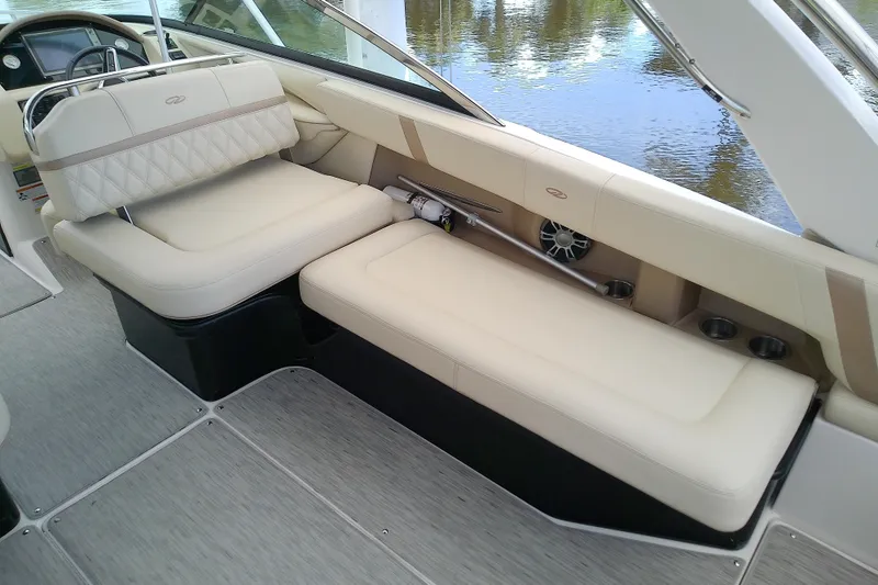 Slide: The Image of 2019 Regal 29 OBX boat interior with beige seating and modern design. - 19