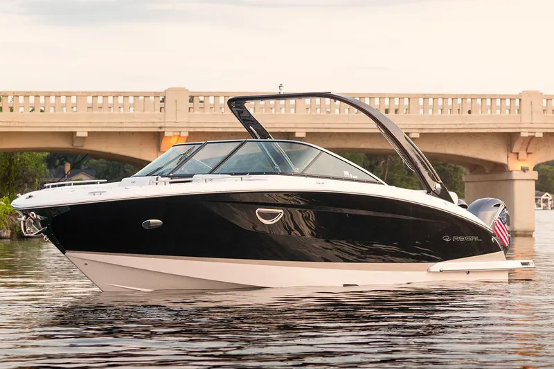 Slide: The Image of Manufacturer Provided Image: 2019 Regal 29 OBX boat on water near a bridge. - 48