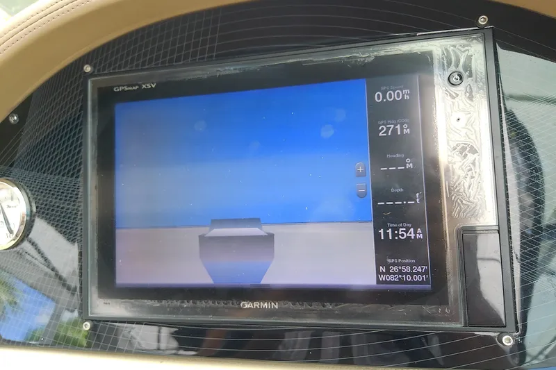 Slide: The Image of Garmin GPS display on 2019 Regal 29 OBX boat dashboard, showing navigation data. - 30