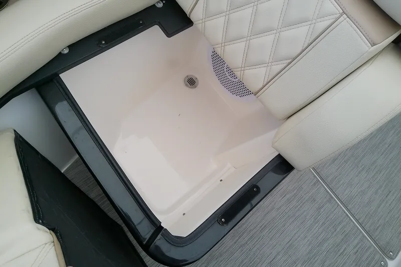 Slide: The Image of Storage compartment in 2019 Regal 29 OBX boat with cushioned seating. - 44
