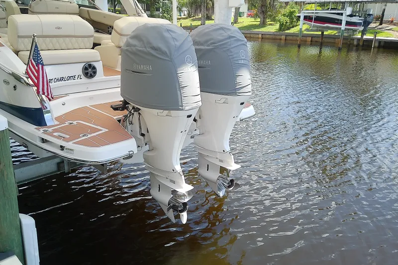 Slide: The Image of 2019 Regal 29 OBX boat with twin Yamaha outboard motors docked in Port Charlotte. - 8