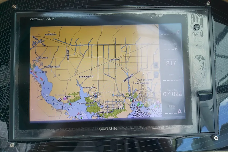 Slide: The Image of Garmin GPS display on a 2019 Regal 29 OBX boat showing a detailed nautical map. - 28