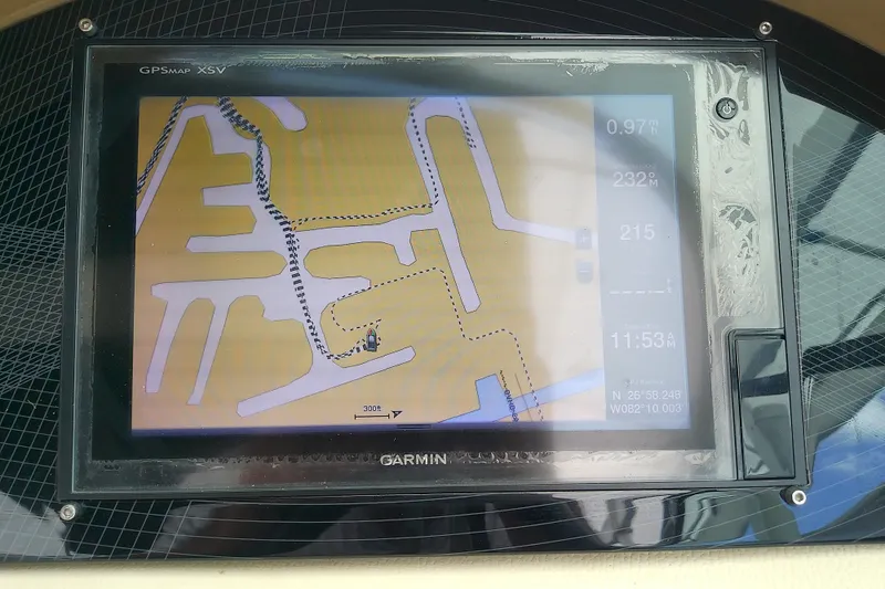 Slide: The Image of Garmin GPS display on 2019 Regal 29 OBX boat showing navigational map and coordinates. - 29