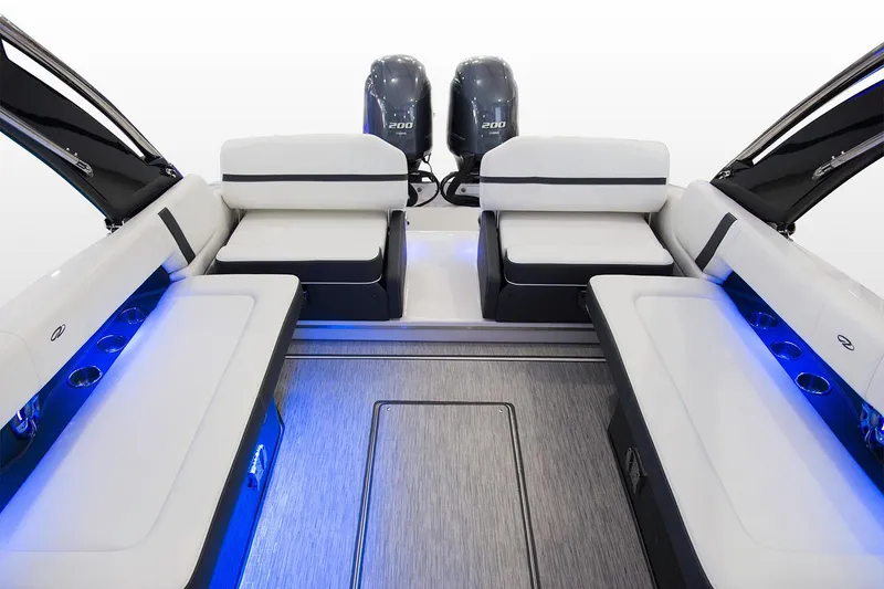 Slide: The Image of Manufacturer Provided Image: 2019 Regal 29 OBX boat interior with dual outboard engines and blue LED lighting. - 49