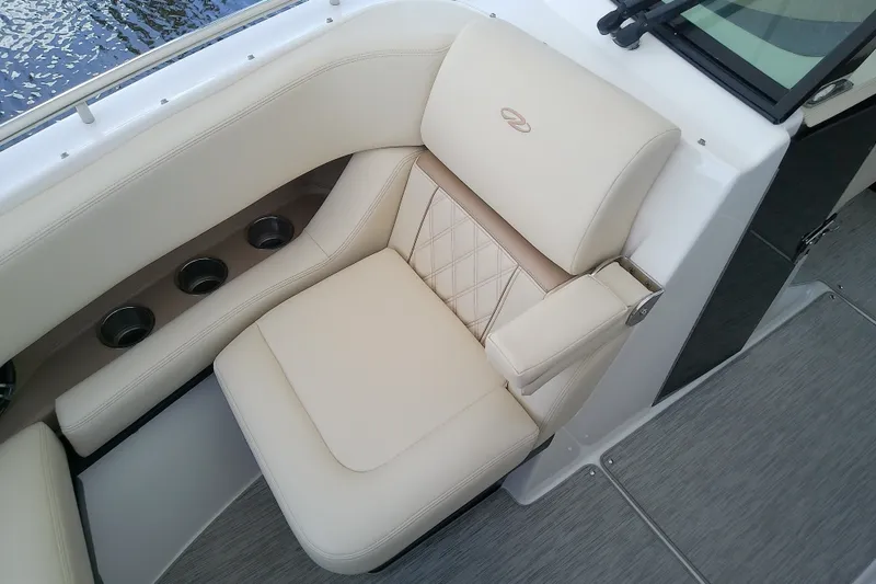 Slide: The Image of Luxurious seating on 2019 Regal 29 OBX boat with cup holders and elegant design. - 38