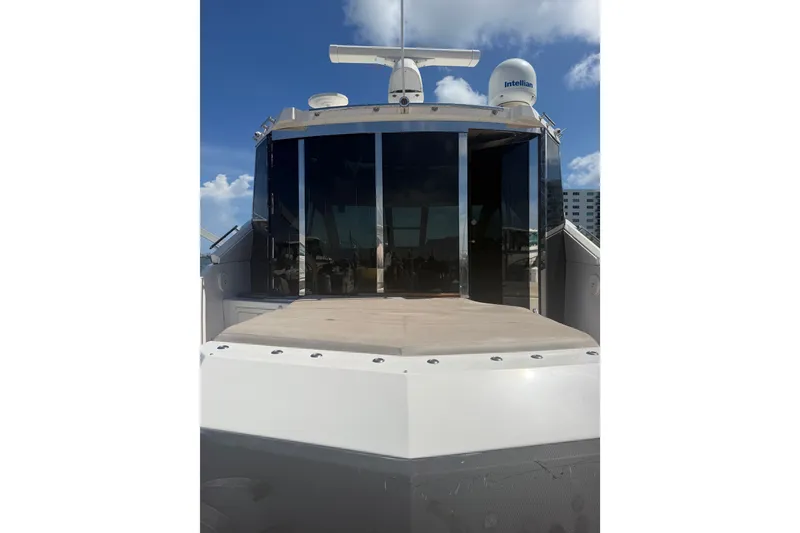 Slide: The Image of 2013 Regal 52 Sport Coupe yacht with sleek design and modern features. - 6