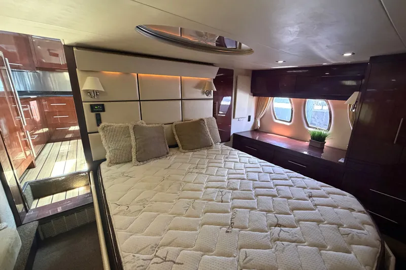 Slide: The Image of Luxurious bedroom interior of 2013 Regal 52 Sport Coupe yacht with elegant furnishings. - 9