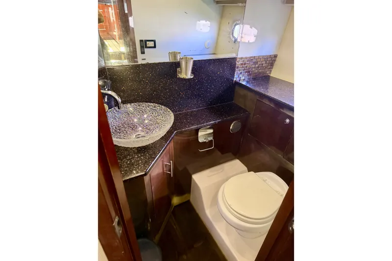 Slide: The Image of Luxurious bathroom in 2013 Regal 52 Sport Coupe yacht with modern fixtures. - 10