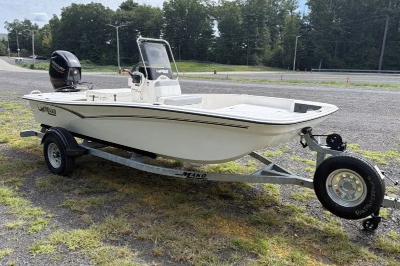 The Image of 2026 Mako Pro Skiff 15 CC boat on trailer, parked outdoors. - 0