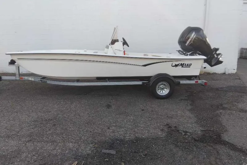 The Image of 2026 Mako Pro Skiff 17 CC boat on trailer, side view. - 0