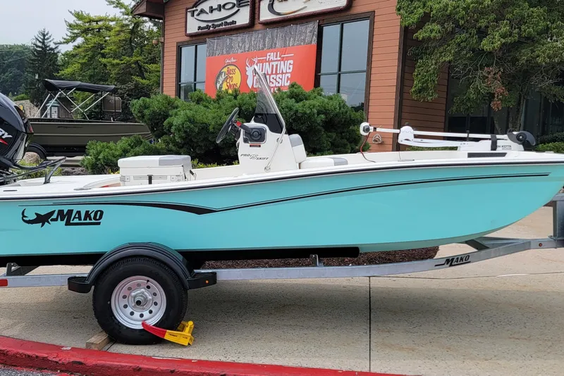 The Image of 2026 Mako Pro Skiff 15 CC boat on trailer, displayed outdoors. - 0
