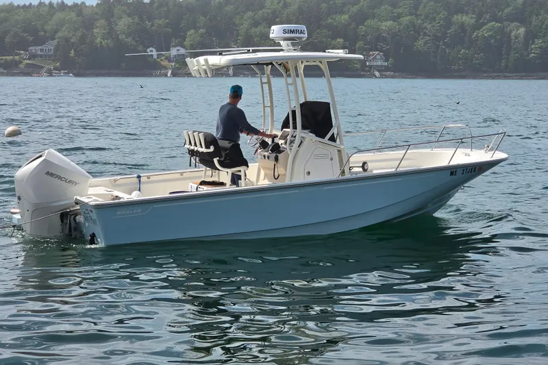 The Image of 2023 Boston Whaler 210 Montauk boat on water, with Mercury engine, scenic background. - 0