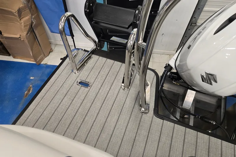 Slide: The Image of 2027 Godfrey Sweetwater 2286 SBC boat deck with chrome ladder and outboard motor. - 20