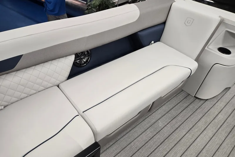Slide: The Image of 2027 Godfrey Sweetwater 2286 SBC boat interior with plush seating and modern design. - 6