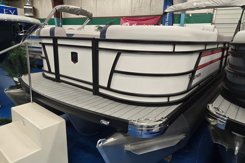 Slide: The Image of 2027 Godfrey Sweetwater 2286 SBC pontoon boat displayed indoors. - 3