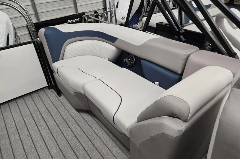 Slide: The Image of 2027 Godfrey Sweetwater 2286 SBC boat interior with plush seating and modern design. - 16