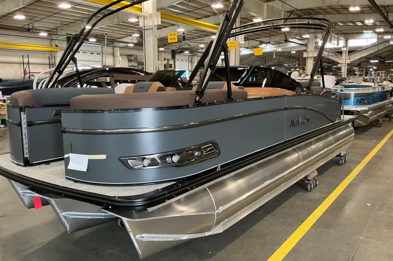 The Image of 2027 Avalon Catalina Platinum Quad Lounge pontoon boat in a factory setting. - 1