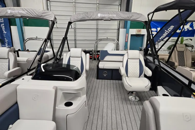 Slide: The Image of 2027 Godfrey Sweetwater 2286 SFLC pontoon boat interior with plush seating and modern design. - 3