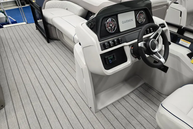 Slide: The Image of 2027 Godfrey Sweetwater 2286 SFLC boat interior with Garmin dashboard and seating. - 22