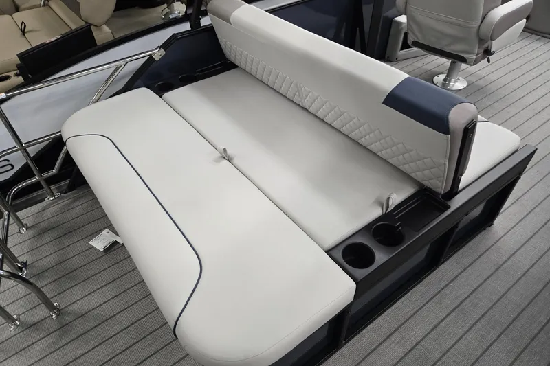 Slide: The Image of 2027 Godfrey Sweetwater 2286 SFLC boat interior with cushioned seating and cup holders. - 18