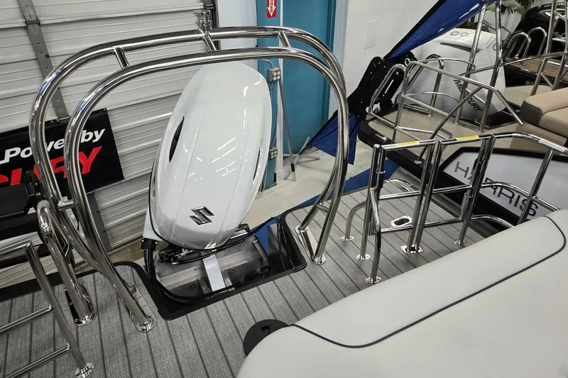 Slide: The Image of 2027 Godfrey Sweetwater 2286 SFLC boat with Suzuki outboard motor and stainless steel railings. - 17