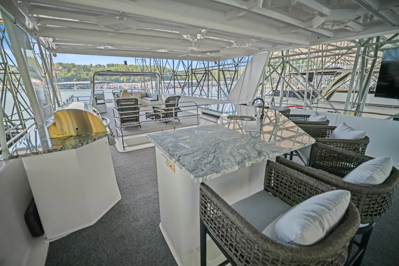 Slide: The Image of Luxurious 2010 Stardust Cruisers houseboat with elegant outdoor seating and granite countertops. - 16