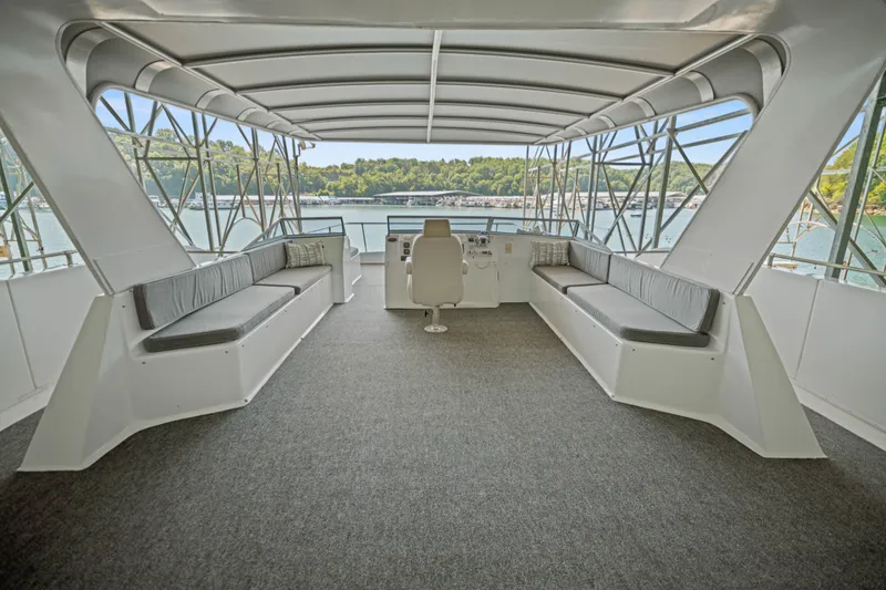 Slide: The Image of Spacious upper deck of 2010 Stardust Cruisers houseboat with seating and scenic water views. - 19