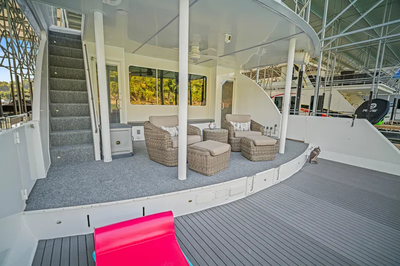 Slide: The Image of Spacious deck of 2010 Stardust Cruisers houseboat with wicker seating and modern design. - 21