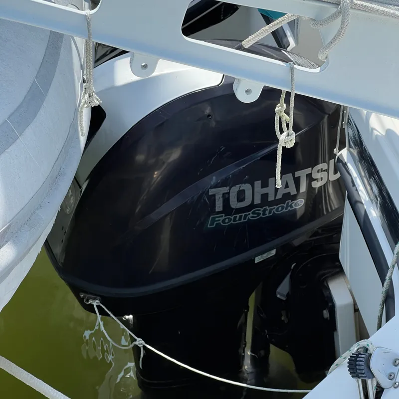 Slide: The Image of A Tohatsu four-stroke engine is mounted on a 1993 Gemini Catamaran 3400. - 13