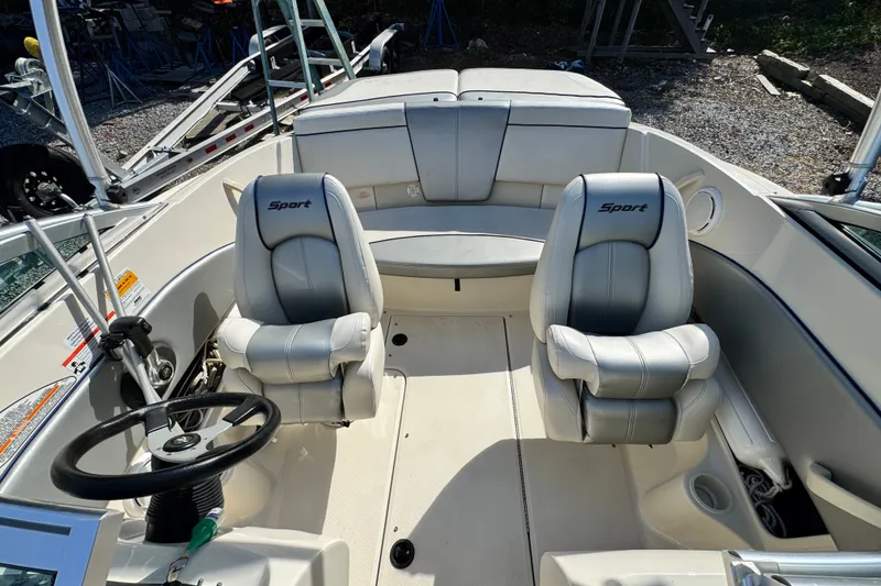 Slide: The Image of Interior of a 2010 Sea Ray 185 Sport boat with two cushioned seats. - 7