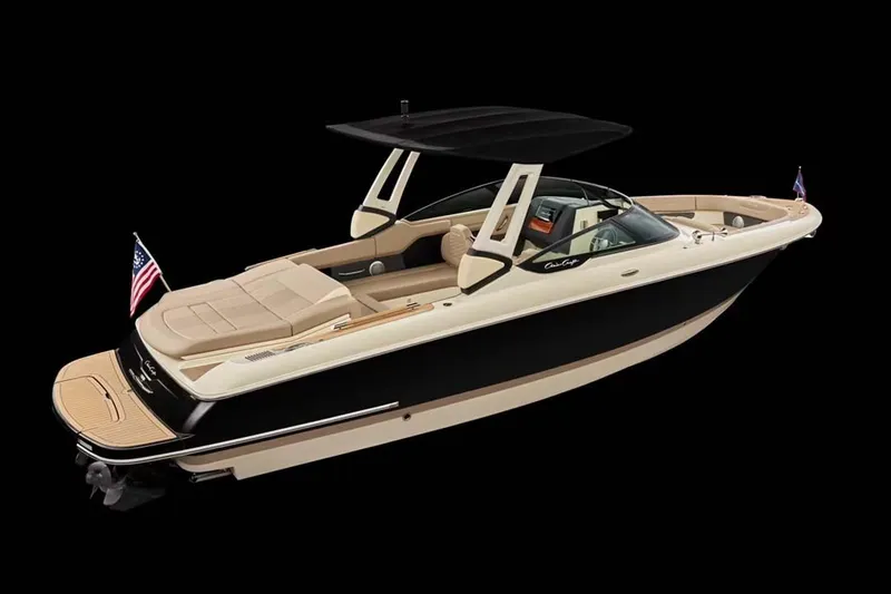 Slide: The Image of Manufacturer Provided Image: Manufacturer Provided Image: 2025 Chris-Craft Sportster 28 luxury boat with sleek design and American flag. - 2