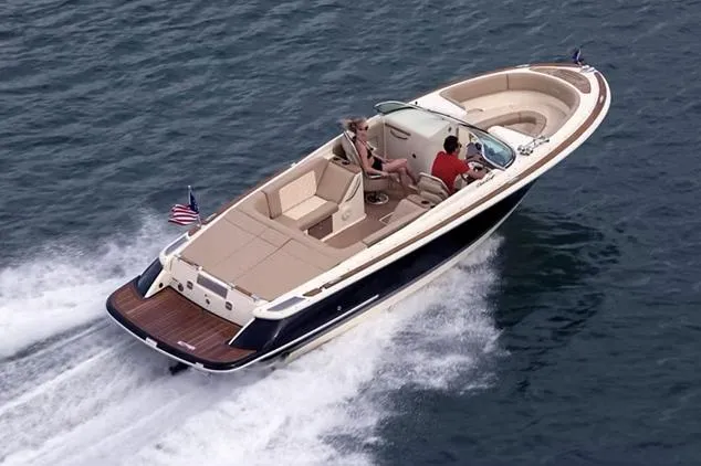 Slide: The Image of Manufacturer Provided Image: 2025 Chris-Craft Launch 27 cruising on open water, showcasing luxury design and performance. - 2