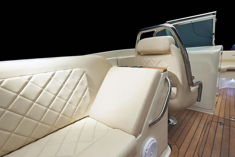 Slide: The Image of Manufacturer Provided Image: Luxurious interior of 2025 Chris-Craft Launch 27 boat with elegant seating and wood flooring. - 9