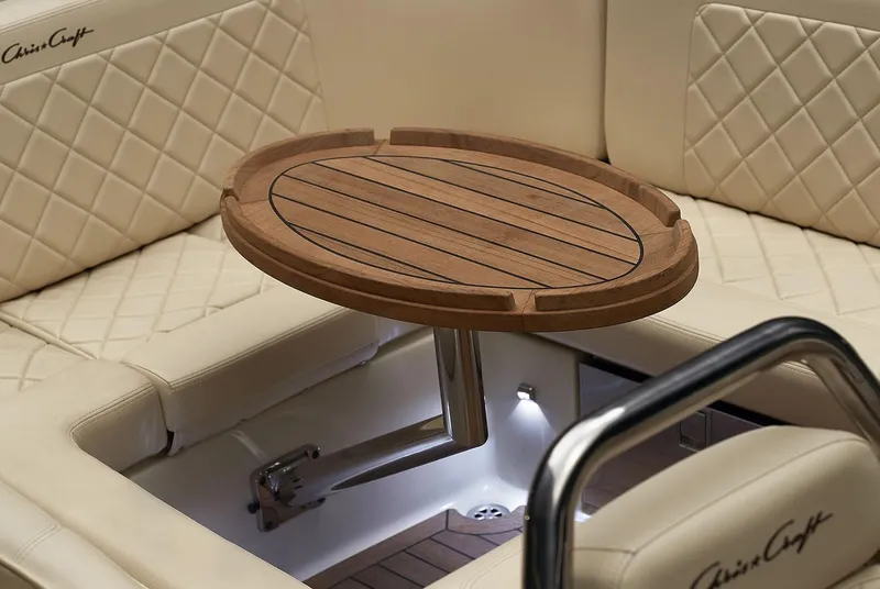 Slide: The Image of Manufacturer Provided Image: Luxurious 2025 Chris-Craft Launch 27 interior with elegant wooden table and quilted seating. - 12
