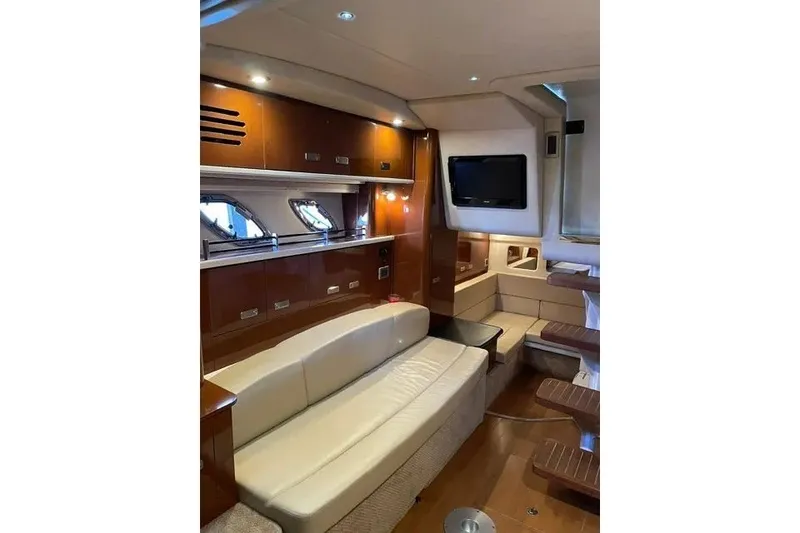 Slide: The Image of Luxurious interior of 2010 Sea Ray Sundancer 330 yacht with leather seating and wood accents. - 14