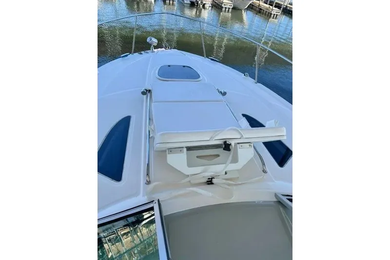 Slide: The Image of 2010 Sea Ray Sundancer 330 boat deck with sunpad and water view. - 5