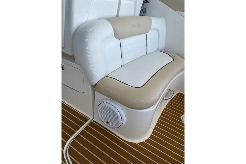 Slide: The Image of 2010 Sea Ray Sundancer 330 boat seat with integrated speaker on teak deck. - 6