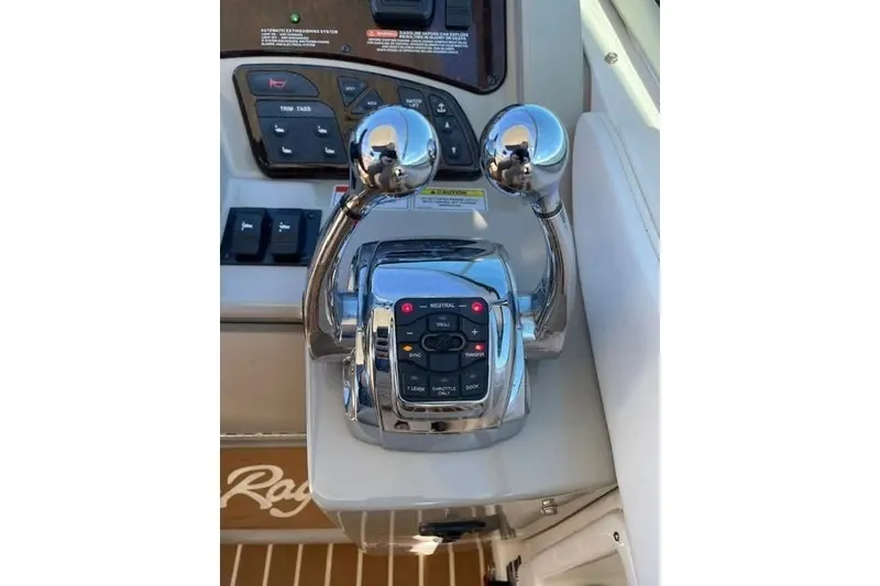 Slide: The Image of Control panel of 2010 Sea Ray Sundancer 330 boat with dual throttle levers. - 11