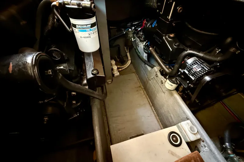 Slide: The Image of Engine compartment of a 2000 Sea Ray 380 Aft Cabin boat, showing mechanical components. - 9