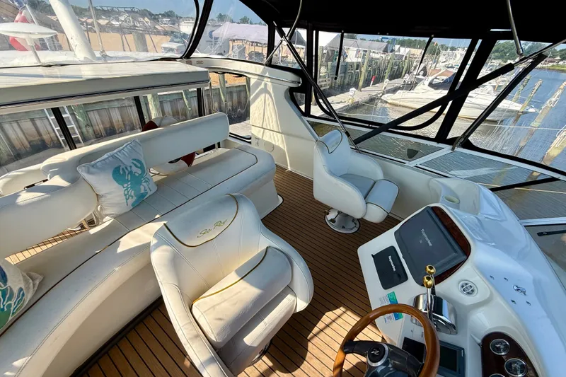 Slide: The Image of Luxurious 2000 Sea Ray 380 Aft Cabin yacht interior with plush seating and modern controls. - 7