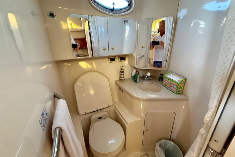 Slide: The Image of Bathroom interior of 2000 Sea Ray 380 Aft Cabin yacht, featuring sink and toilet. - 31
