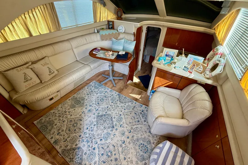Slide: The Image of Luxurious interior of a 2000 Sea Ray 380 Aft Cabin yacht with elegant seating and decor. - 2