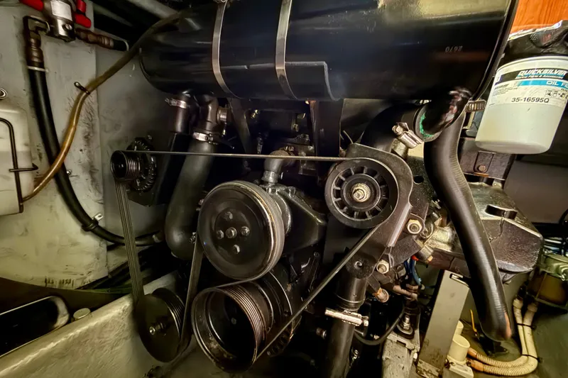 Slide: The Image of Engine compartment of a 2000 Sea Ray 380 Aft Cabin boat, showing mechanical components. - 17