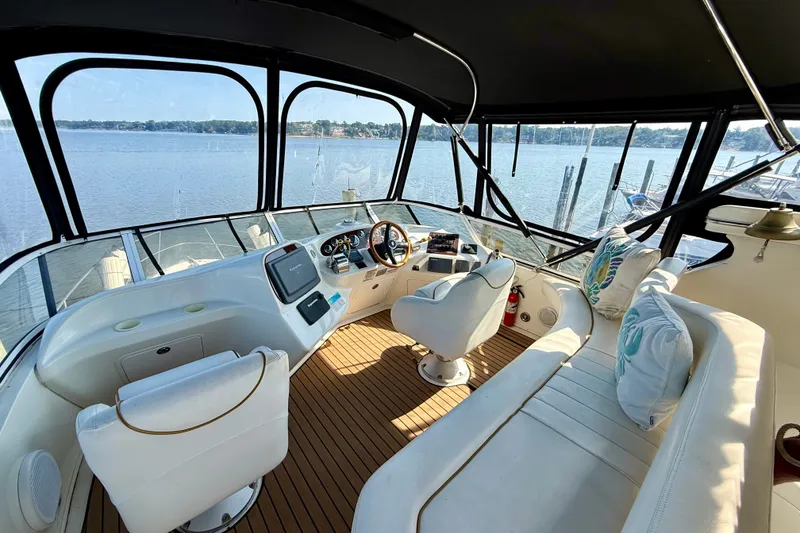 Slide: The Image of Interior of 2000 Sea Ray 380 Aft Cabin yacht with helm and seating area. - 21
