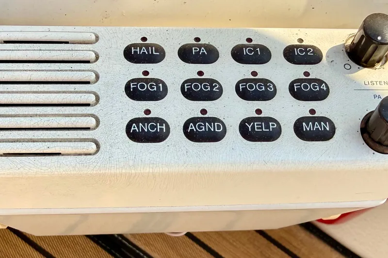 Slide: The Image of Control panel with various buttons on a 2000 Sea Ray 380 Aft Cabin boat. - 25